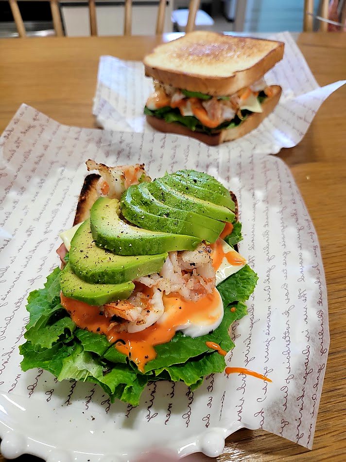 Open-faced shrimp and avocado toast with lettuce, egg and chili mayo, made at home in Seoul